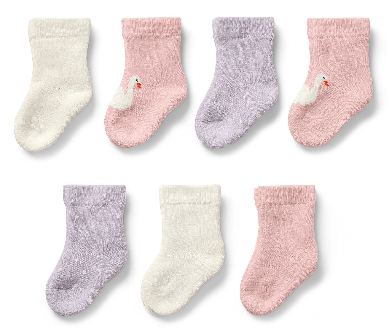 Sedem párov detských ponožiek s motívom labute.