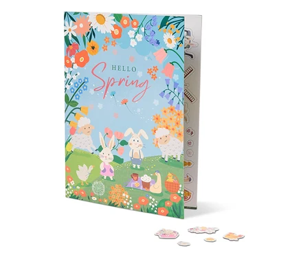 Ilustrácia knihy s názvom "Hello Spring" s ovcami, králikmi, kvetmi a piknikovou dekou.