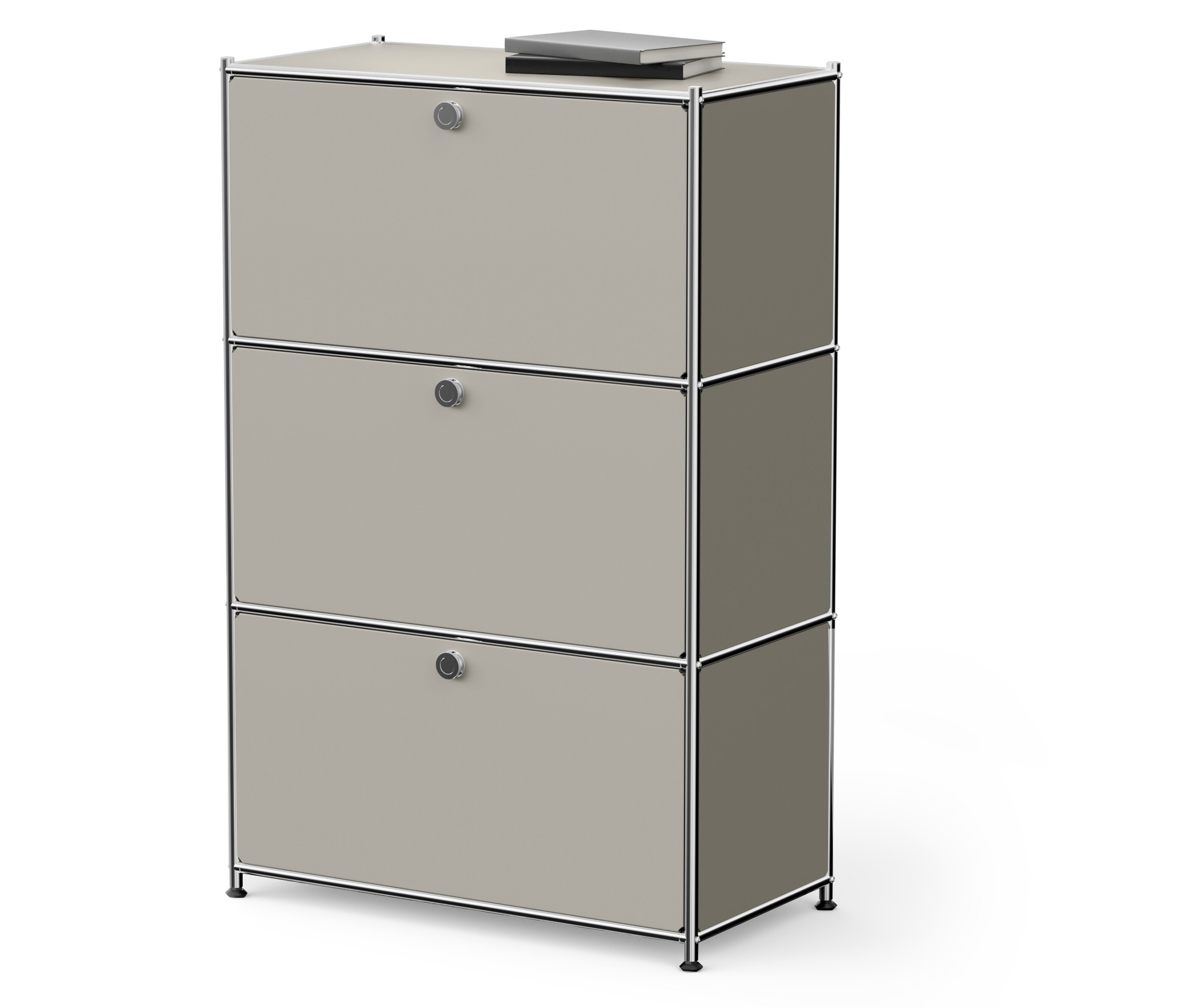 Trojposchodová béžová skrinka s knihou navrchu.