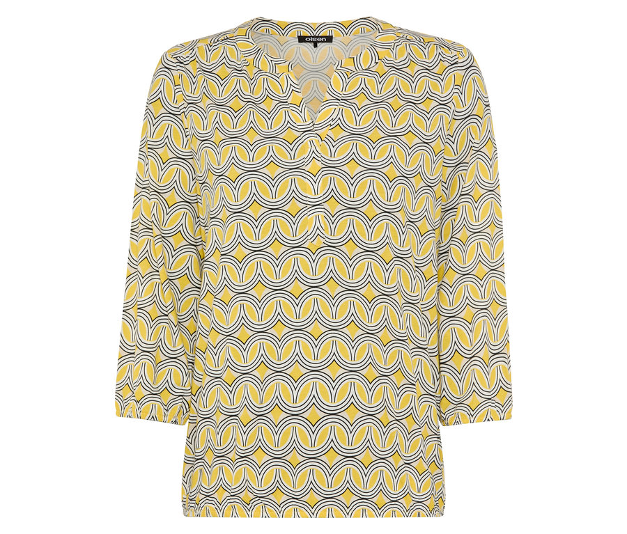 Žltá blúzka s geometrickým vzorom.