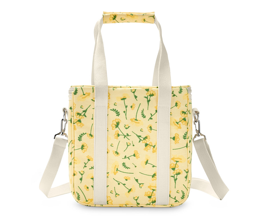 Žltá chladiaca taška s kvetinovým vzorom a bielymi popruhmi.