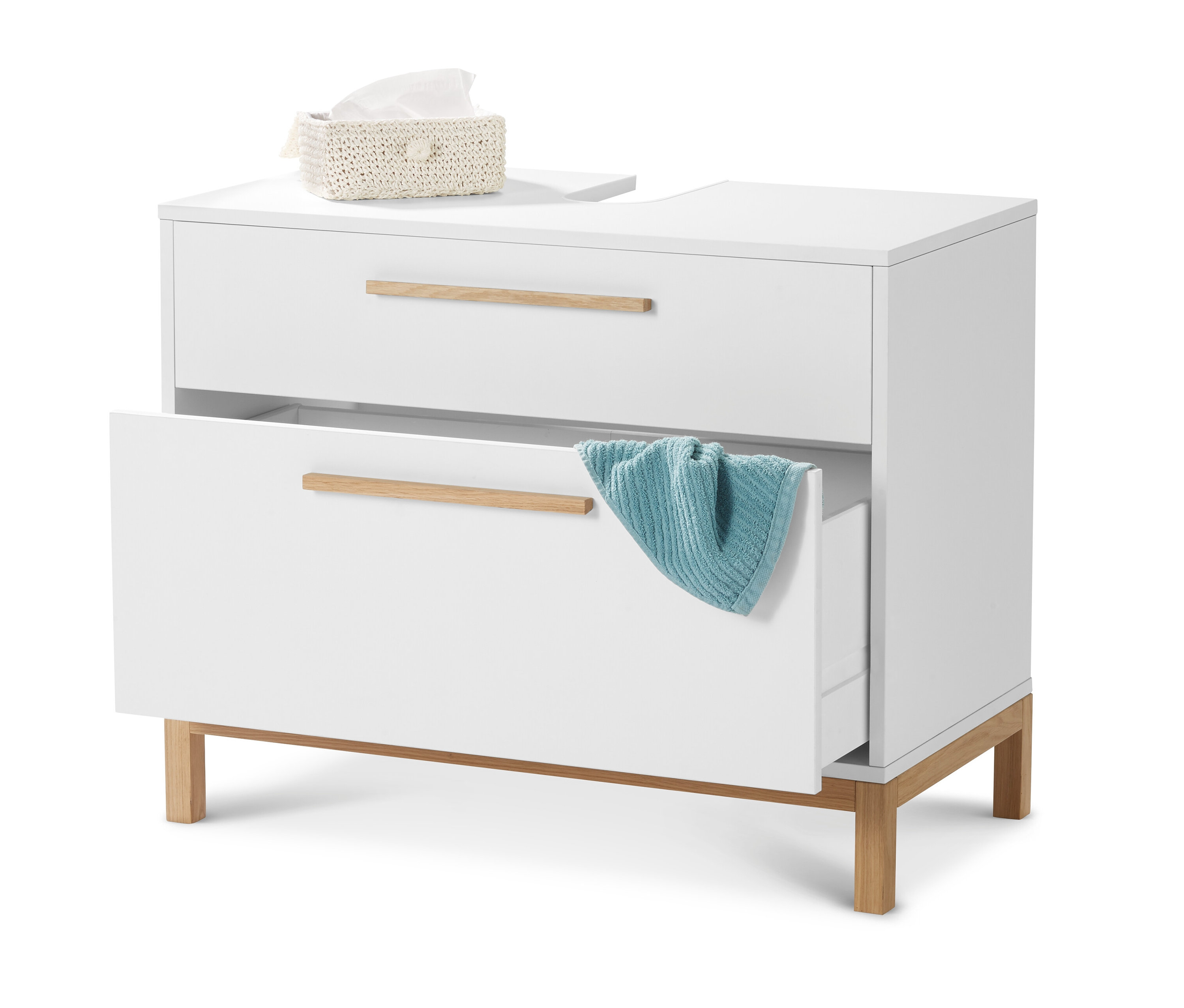 Biela skrinka pod umývadlo »Eklund« s 2 zásuvkami, pričom jedna zásuvka je otvorená a je v nej modrý uterák. Hore leží škatuľka s papierovými vreckovkami.