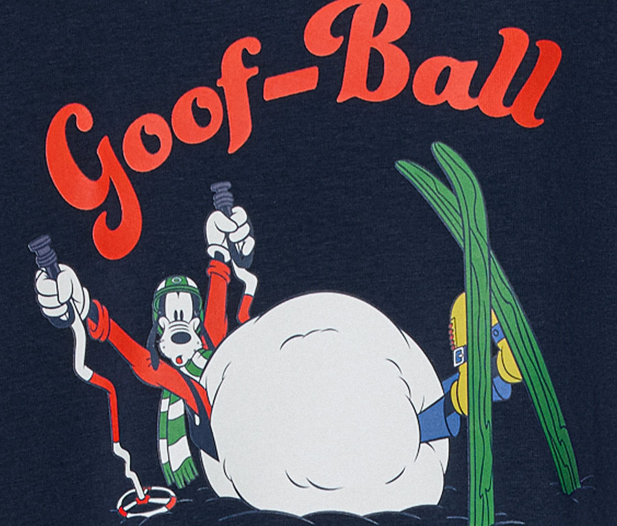 Kreslená postavička Goofy s lyžiarskym výstrojom v zasneženej scéne s nápisom "Goof-Ball".