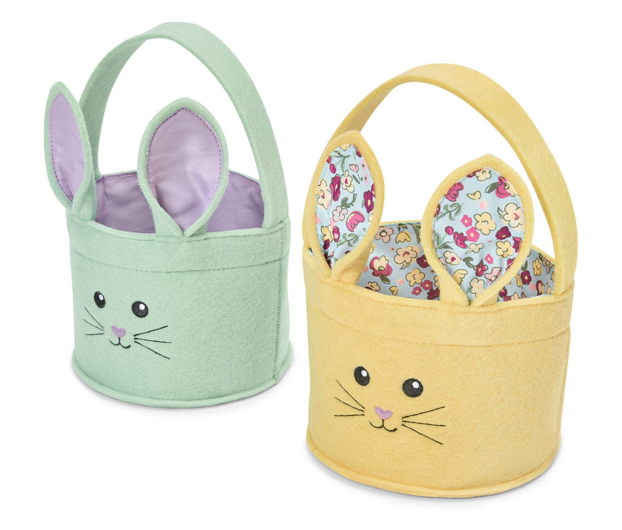 Dva veľkonočné košíky v tvare zajačika, jeden svetlozelený a jeden žltý.
