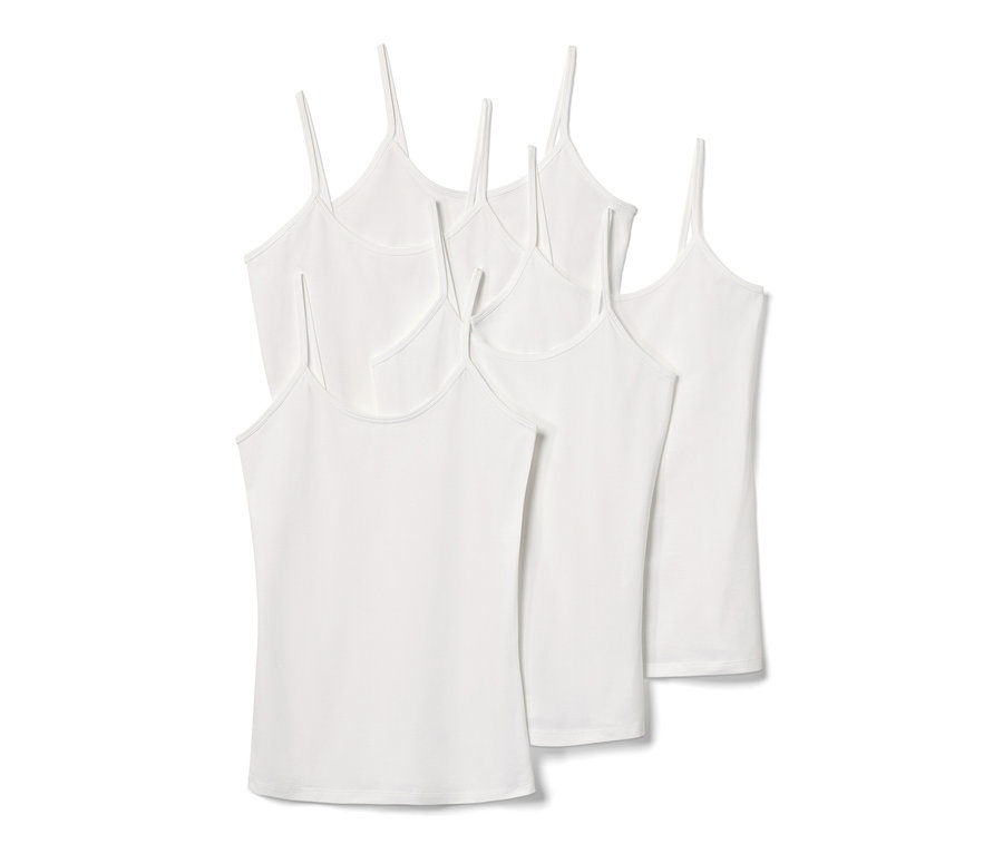 Päť bielych tielok so špagetovými ramienkami.