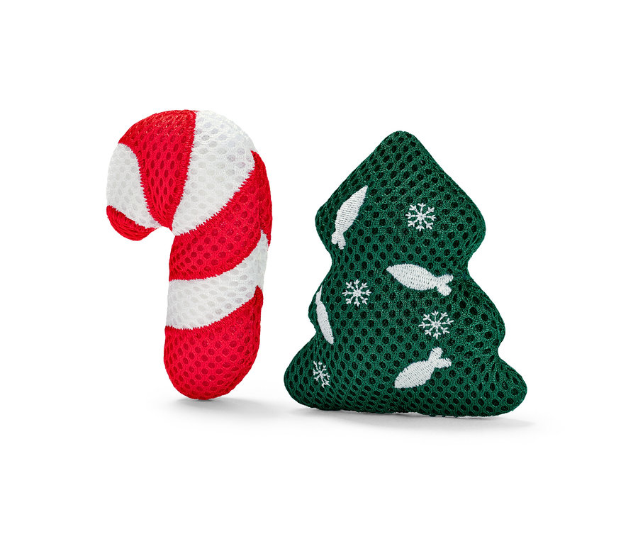 Hračka pre mačky v tvare červeno-bielej cukrovej trstiny a zeleného vianočného stromčeka.