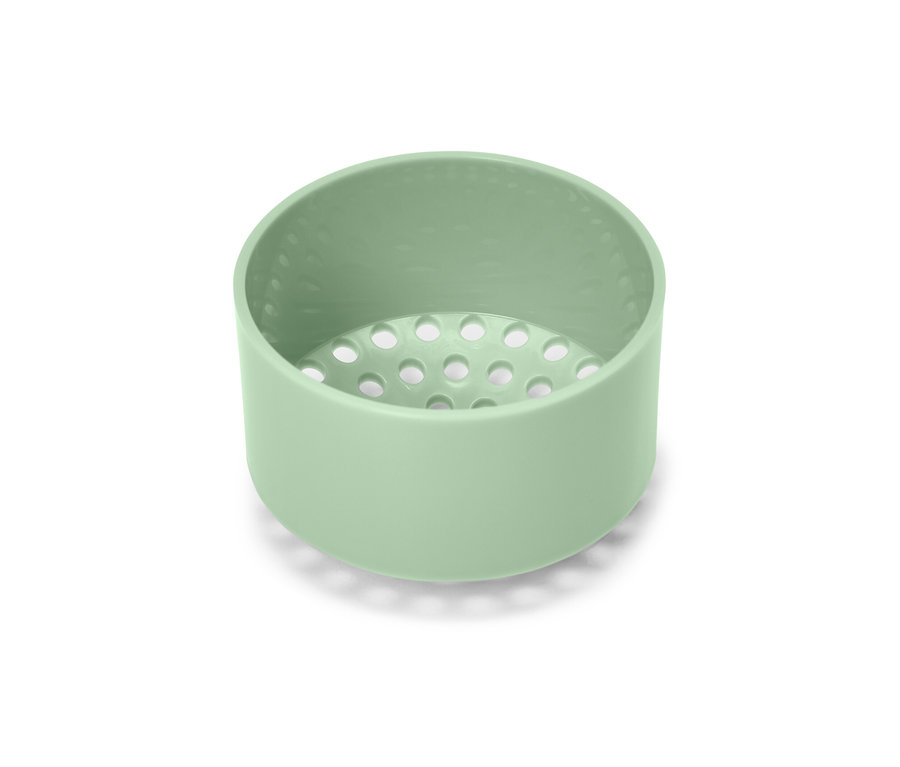 Zelená fľaška na dresing na bielom pozadí.