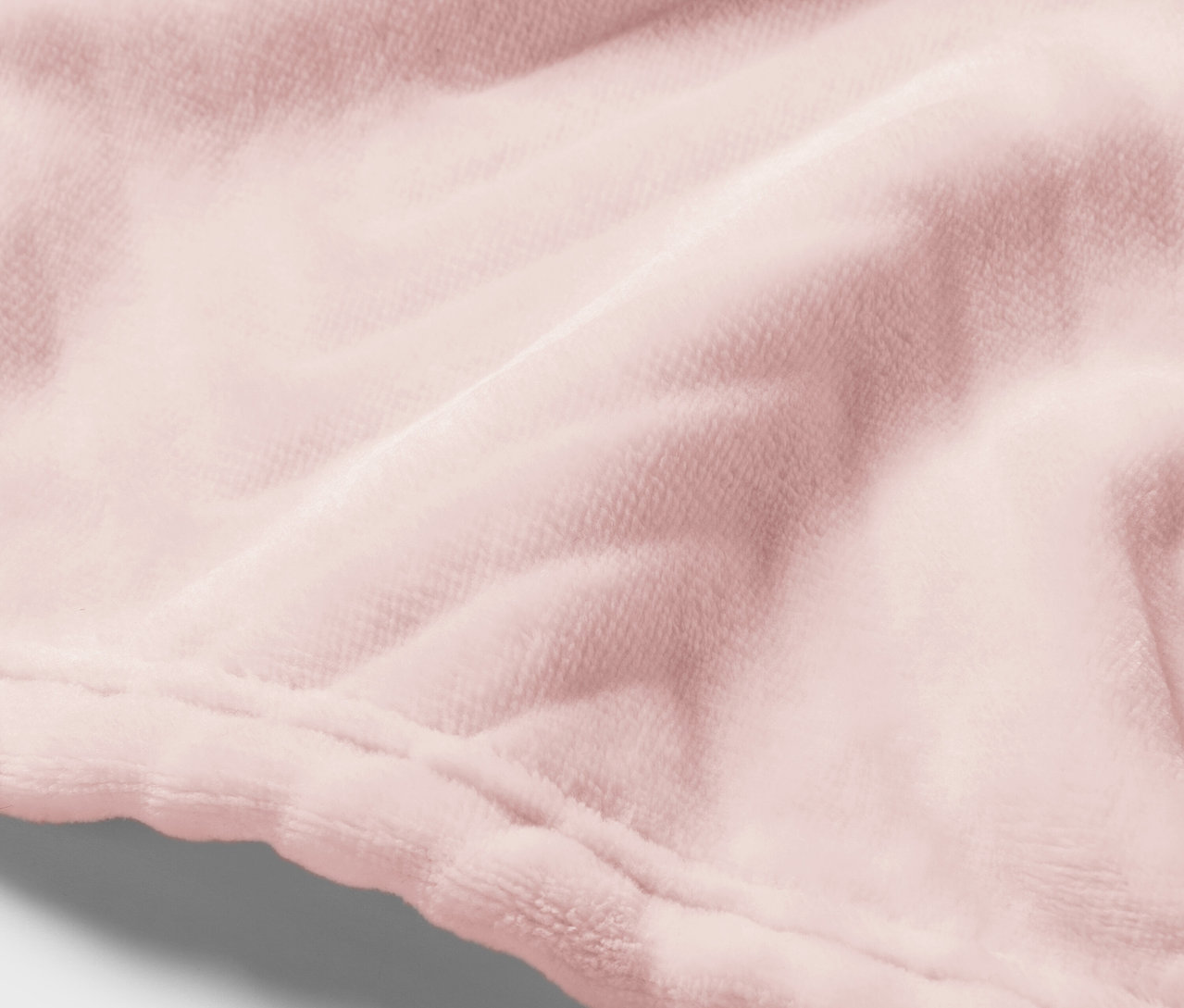 Detail ružovej zamatovej látky so švom.