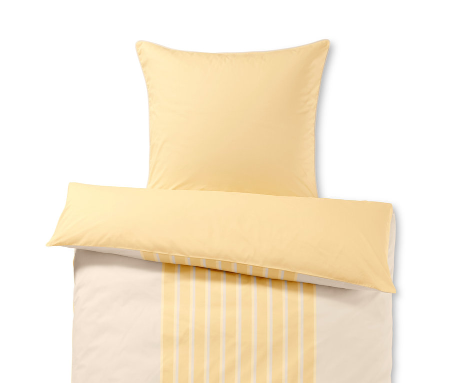 Žlté posteľné obliečky z perkálu štandardnej veľkosti a žltá obliečka na vankúš z perkálu.
