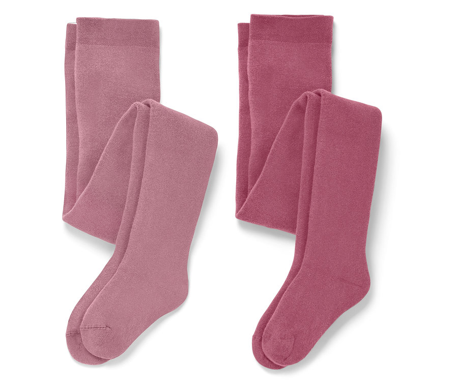 Dvoje zložené pančuchové nohavice v odtieňoch ružovej.