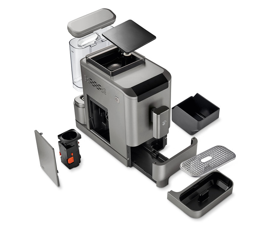 Čiastočne rozobratý plnoautomatický kávovar »Esperto2 Caffè« v titánovo striebornej farbe s rôznymi odpojenými časťami.